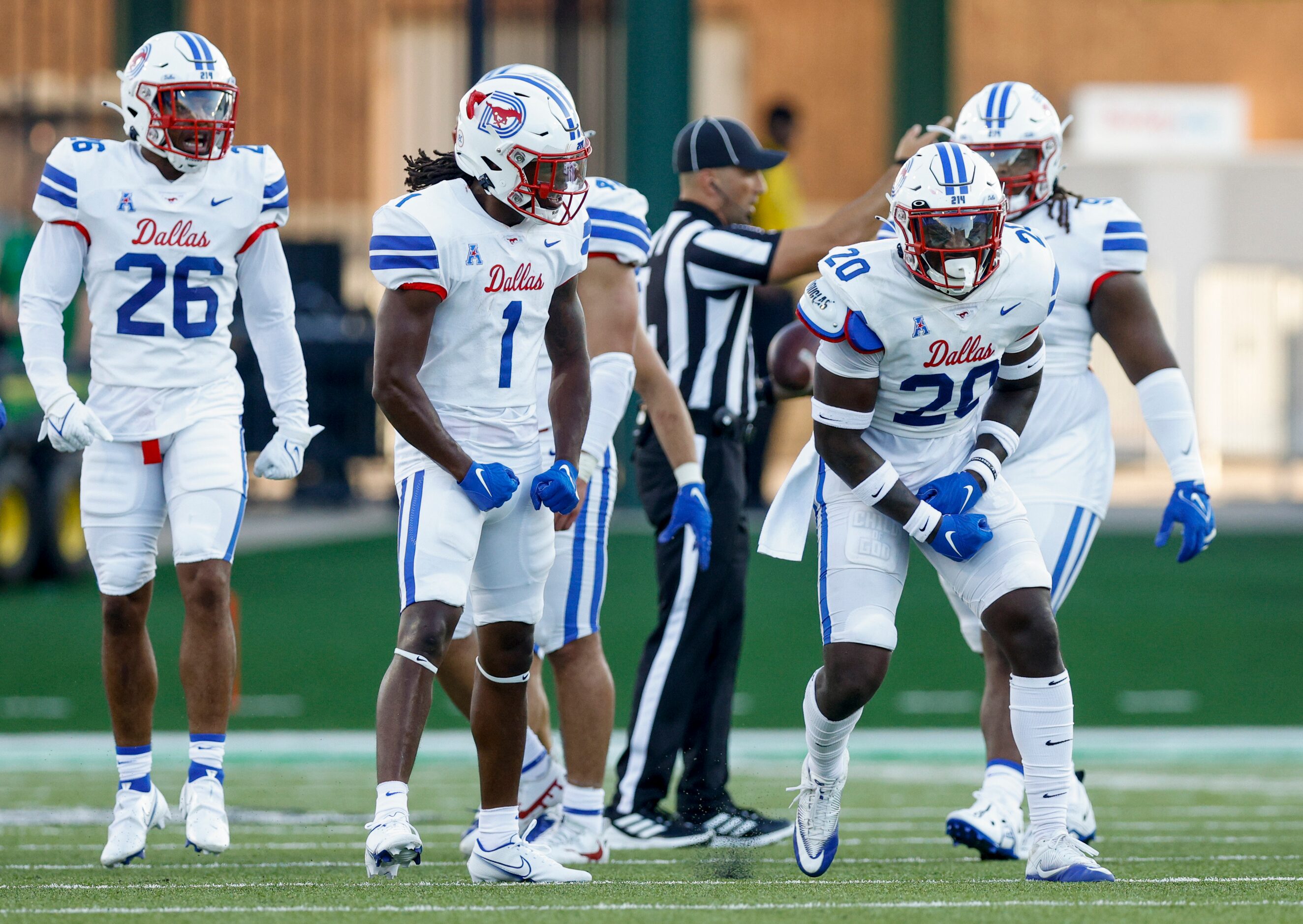 SMU safety Chris Adimora (20) celebrates after forcing a fumble alongside SMU safety Brandon...