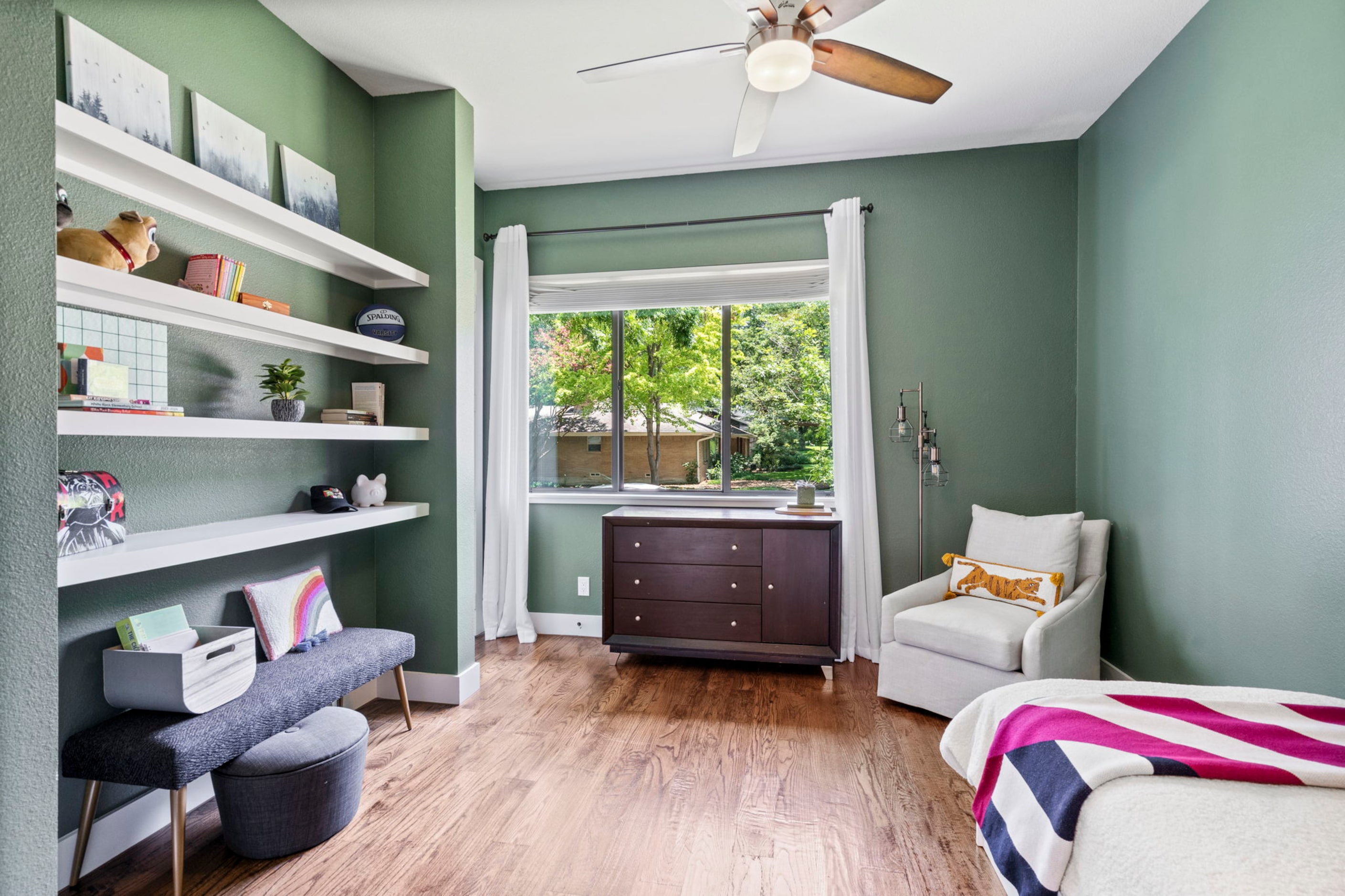 One of the five bedrooms has a wall of shelves for storage.