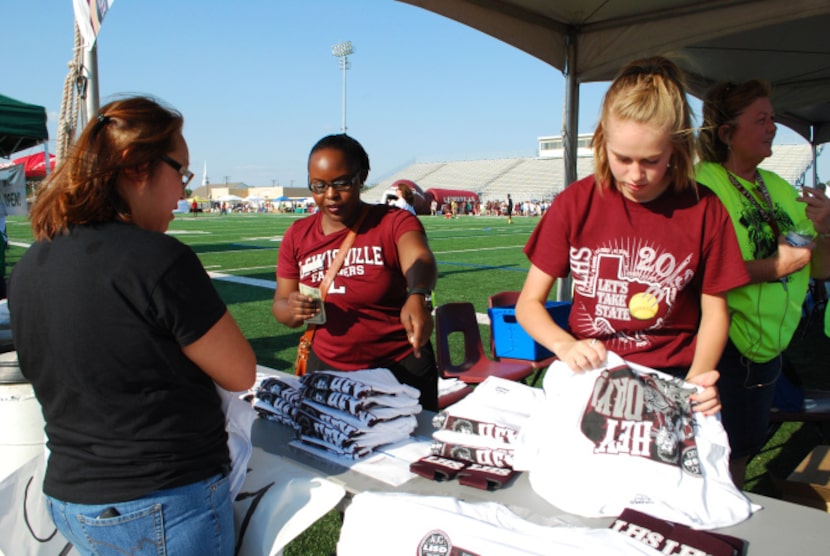 Lewisville High School teacher Shonedra Redd, center, and eighth-grader Avery Bonner, right,...