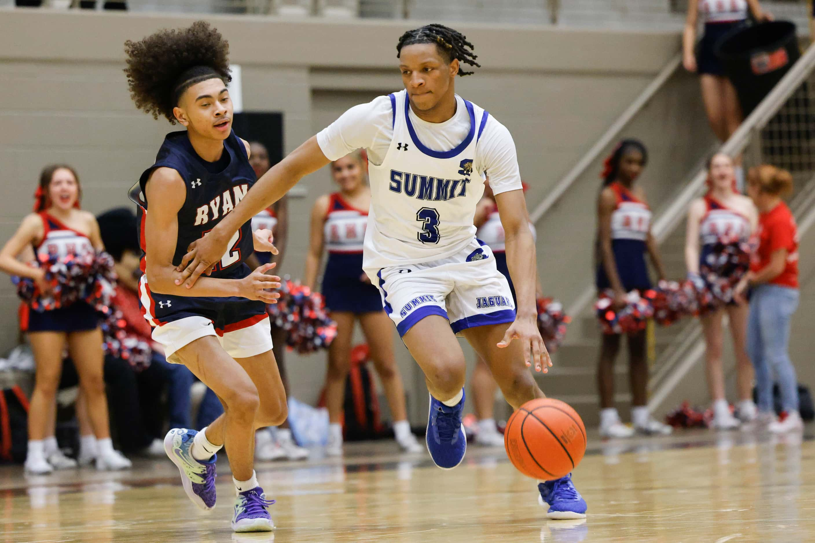 Denton Ryan’s Peter Serunjoji (left) runs behind Mansfield Summit’s Quinton Owens-Ross...