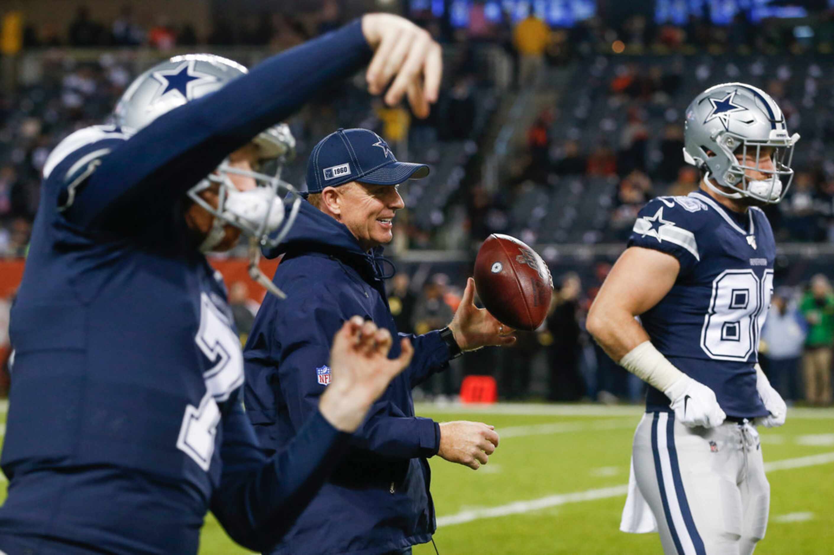 Dallas Cowboys head coach Jason Garrett fires off a warmup pass prior to a NFL matchup...