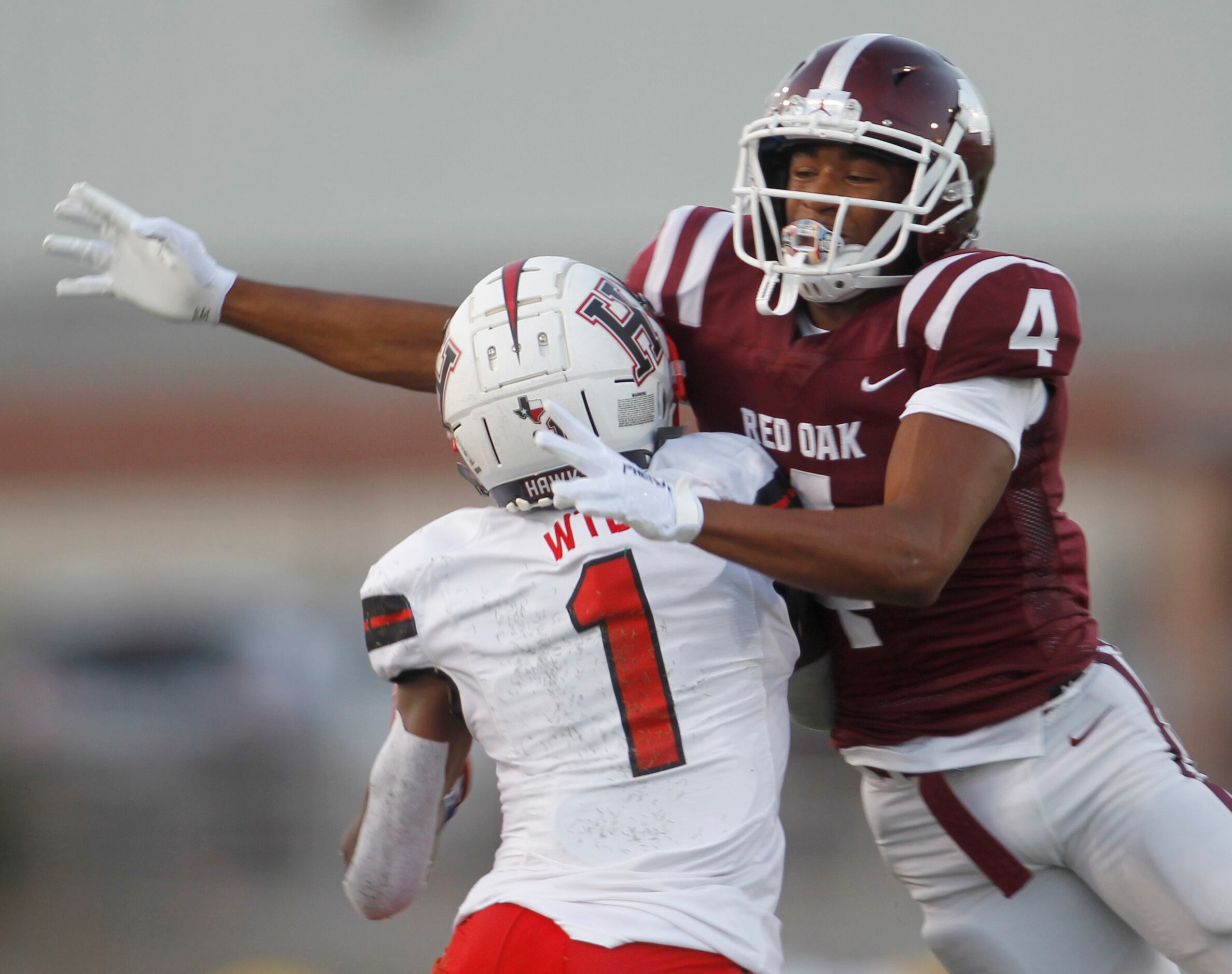 Rockwall Heath receiver Jay Fair (1) draws a pass interference call by Red Oak defensive...