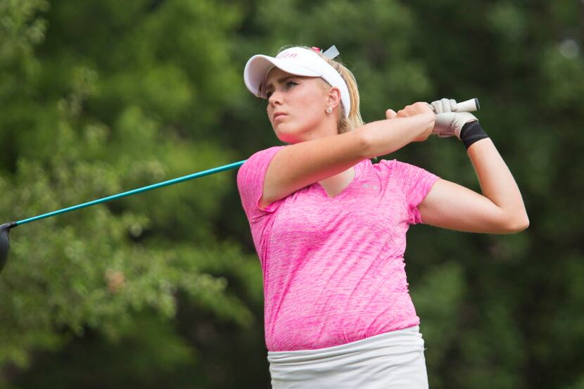 Allen's Ellie Szeryk watches her ball after a hit on hole 18 during the UIL state girls 6A...