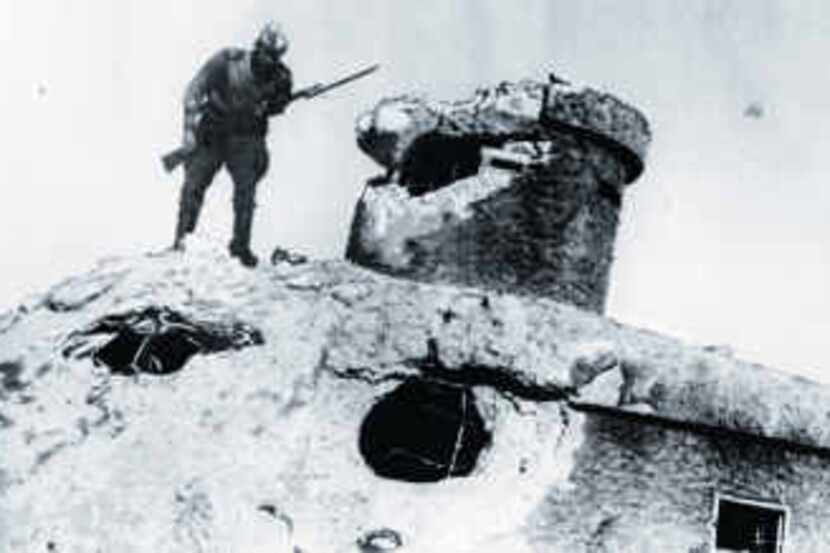 A Soviet soldier inspects a damaged Japanese fortification in China in this photo dated Aug....