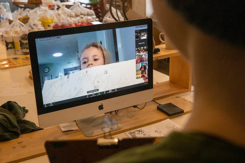 Rosalie Alford, 5, held up her latest artwork during her Oil and Cotton virtual art class in...