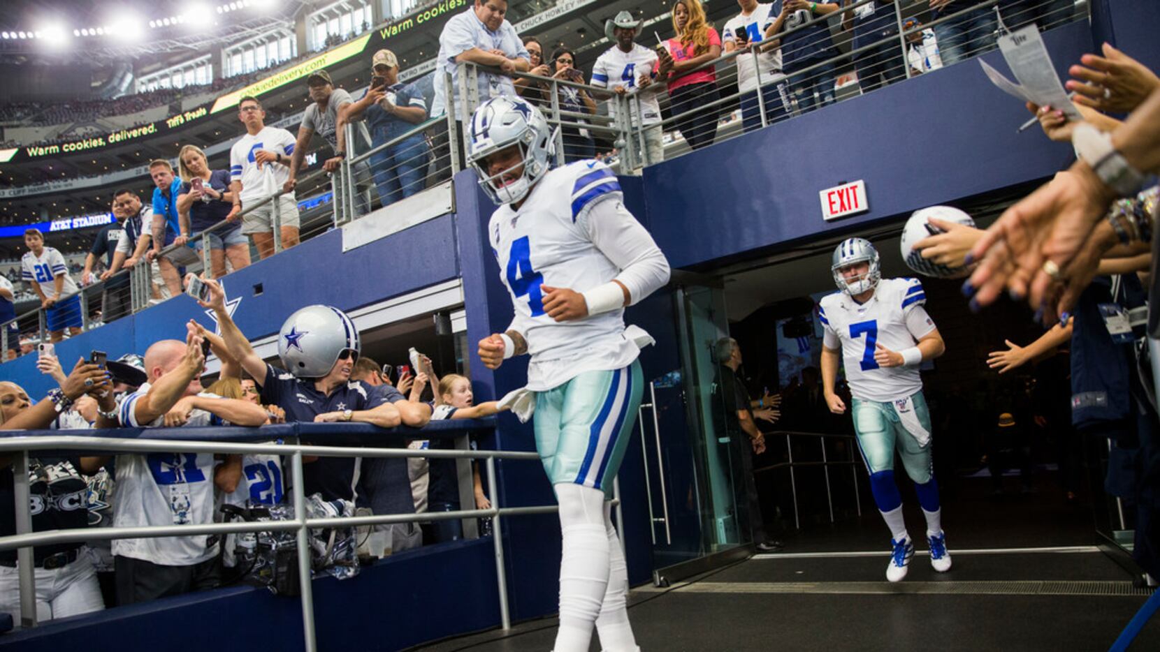 Dallas Cowboys quarterback Dak Prescott (4) enters the field for warm ups before an NFL game...
