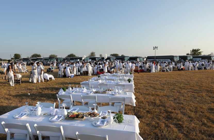 Participants prepare for the Diner en Blanc event at Southfork Ranch in Parker, TX, on Oct....
