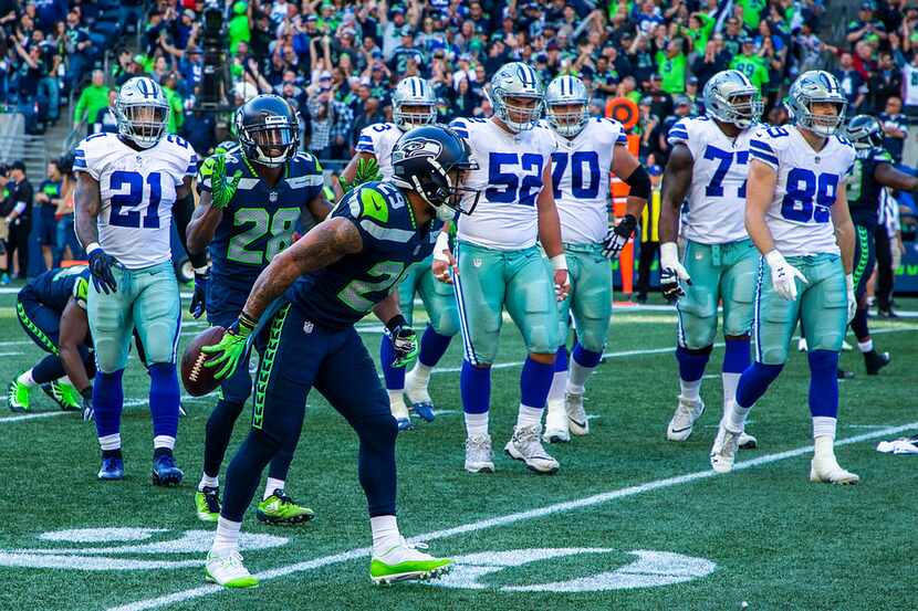 FILE - Seahawks safety Earl Thomas (29) bows toward the Cowboys sideline after intercepting...