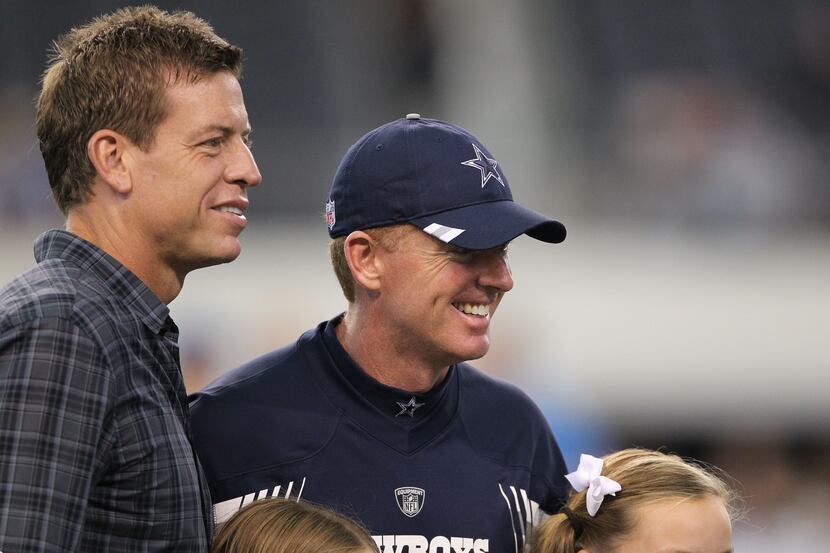 Cowboys former quarterback Troy Aikman (left) poses for a picture with head coach Jason...