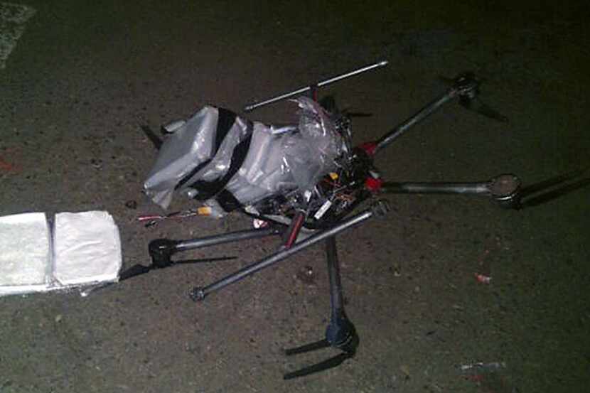 Tijuana Municipal Police released this image of a drone loaded with packages containing...