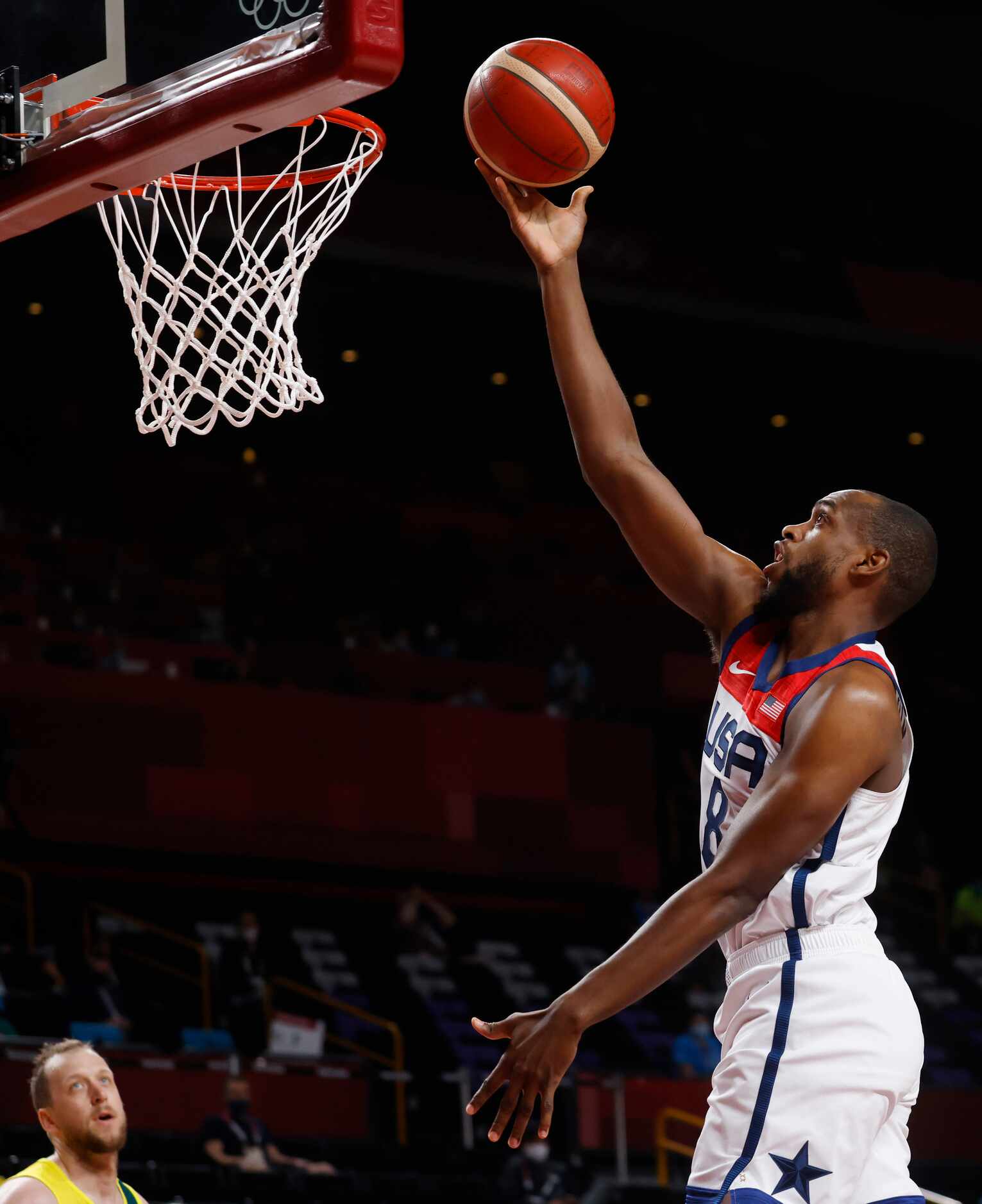 USA’s Khris Middleton (8) attempts a layup in a game against Australia during the first half...