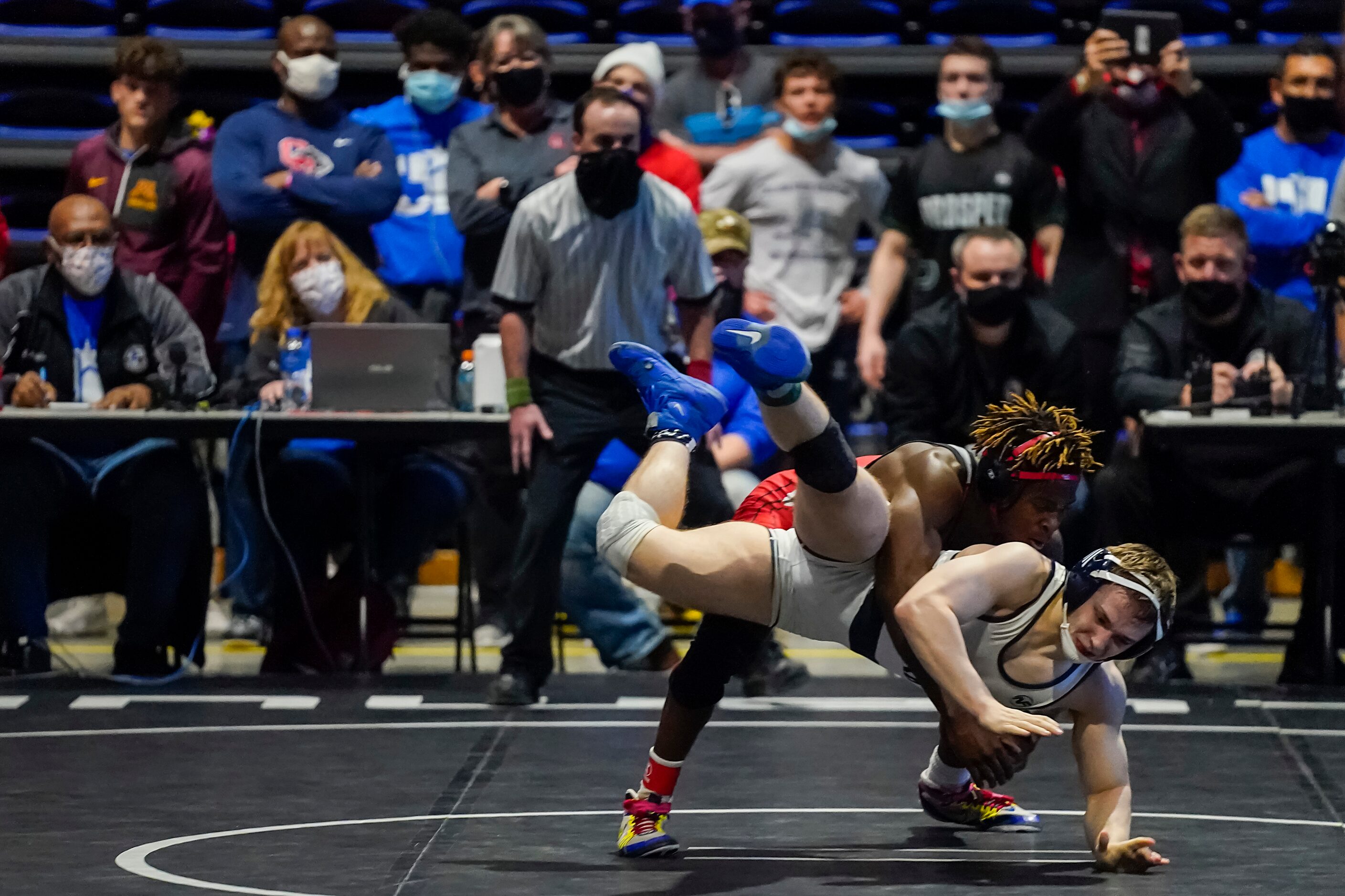 Nasir Bailey of Arlington Martin (top) wrestles Corey Camden of Conroe Woodlands College...