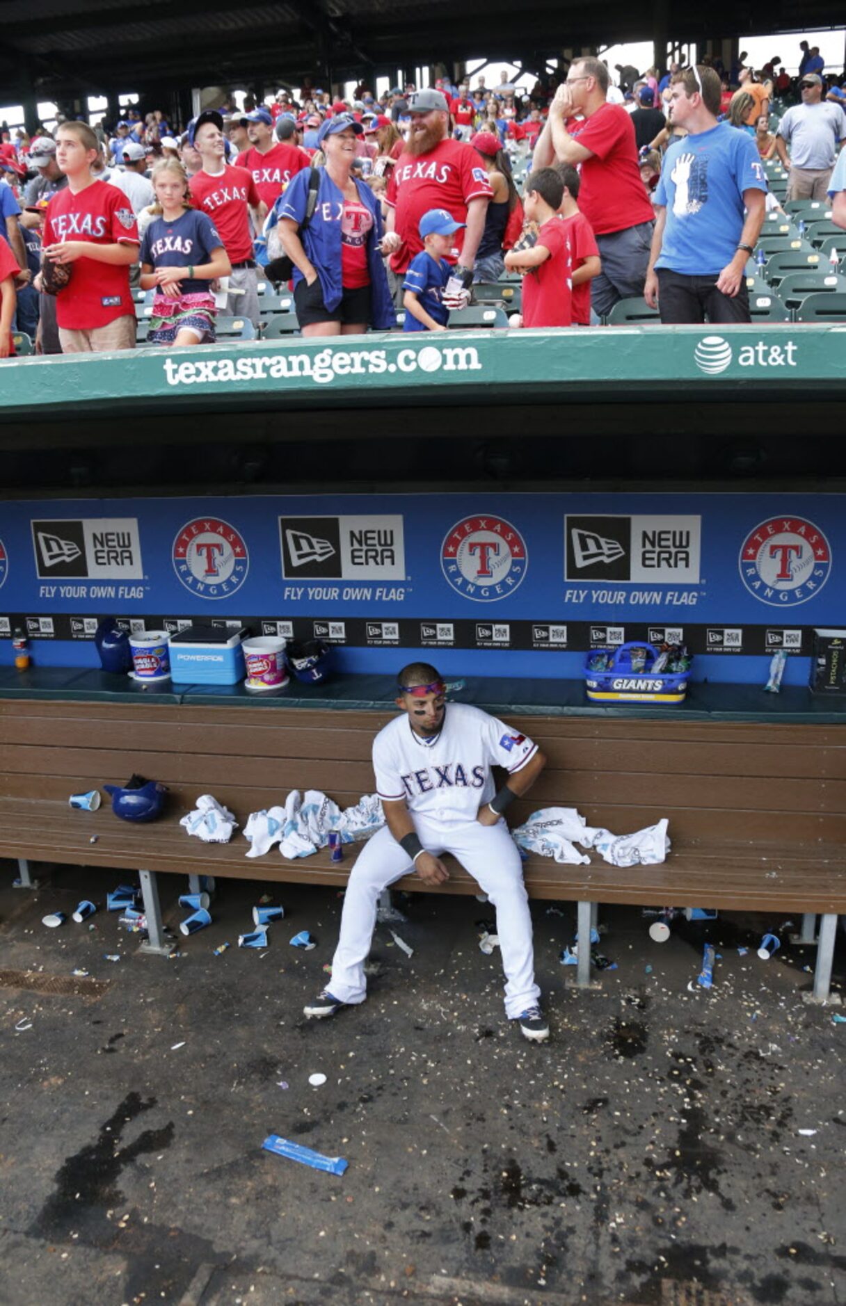 Texas second baseman Rougned Odor remains on the bench as the Oakland Athletics celebrate on...