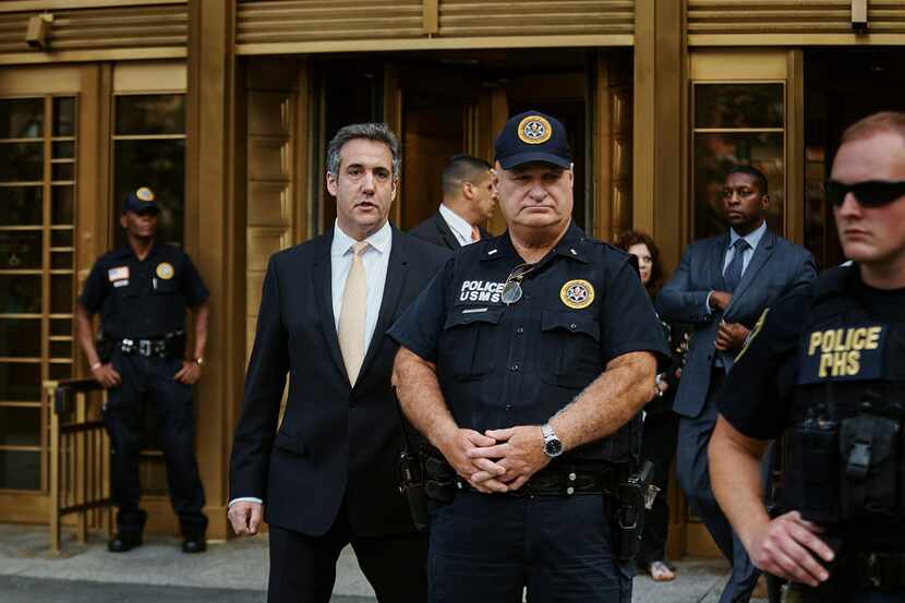 Michael Cohen, left, leaves federal court, in New York, Aug. 21, 2018. (Andres Kudacki/The...