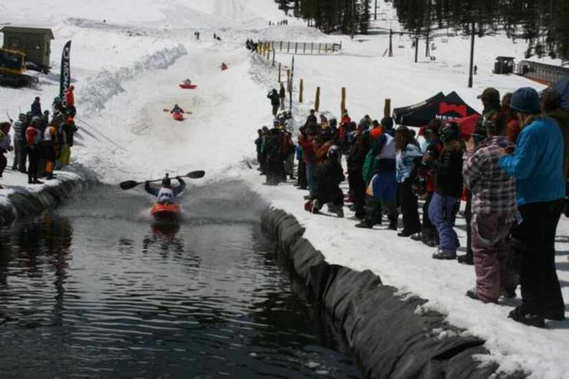 Kayakers will race down a course full of bumps and banks before ending in an icy pond at...