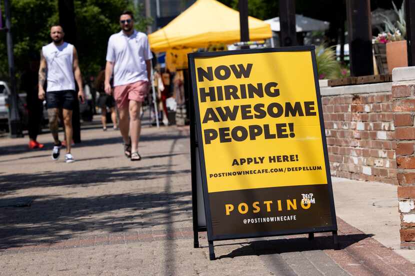Now hiring signs, such as this one in Dallas' Deep Ellum, are common throughout the U.S. On...