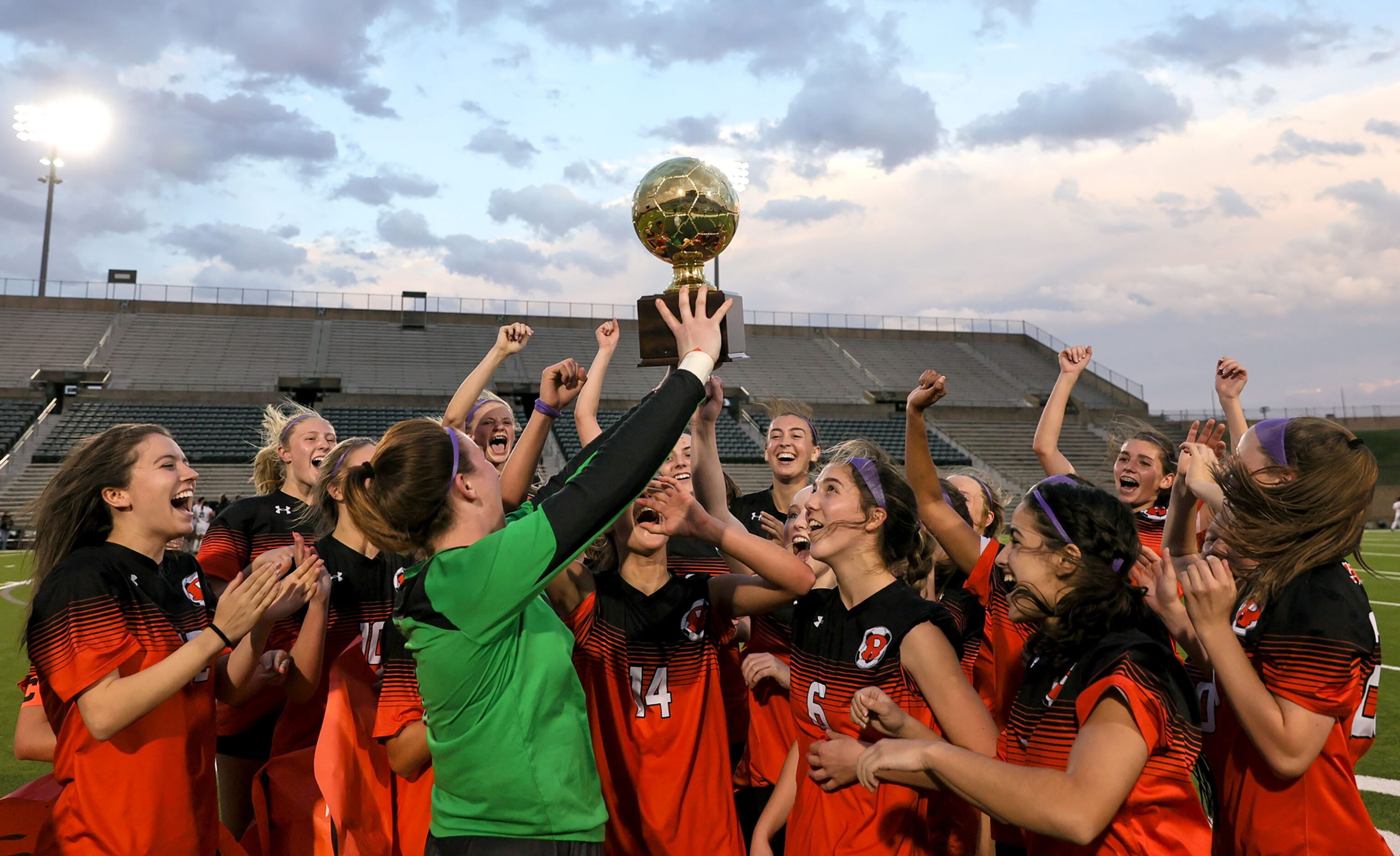 The Rockwall Lady Jackets hold up their trophy after defeating Duncanville, 1-0 in the 6A...