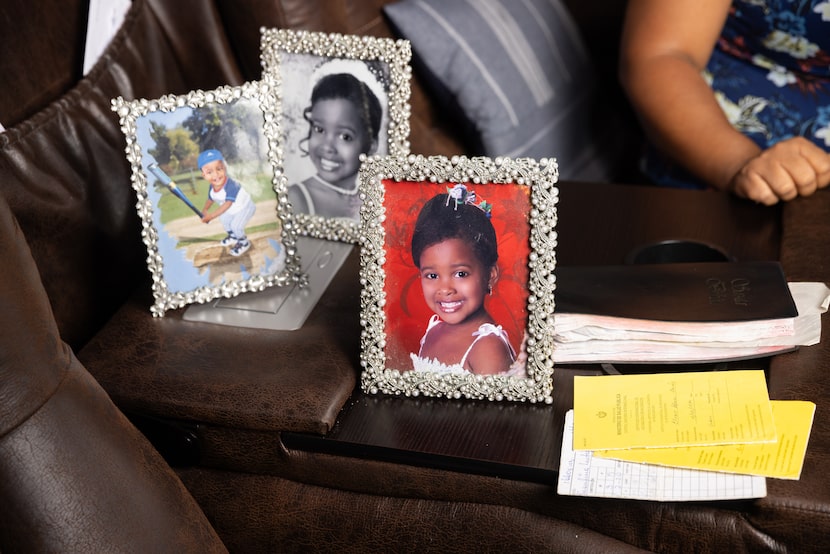 Her children’s photos, medical records and vaccination cards carried by Yennissey Paz, from...