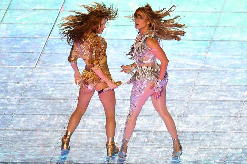 US singer Jennifer Lopez (R) and Colombian singer Shakira (L) perform during the halftime...