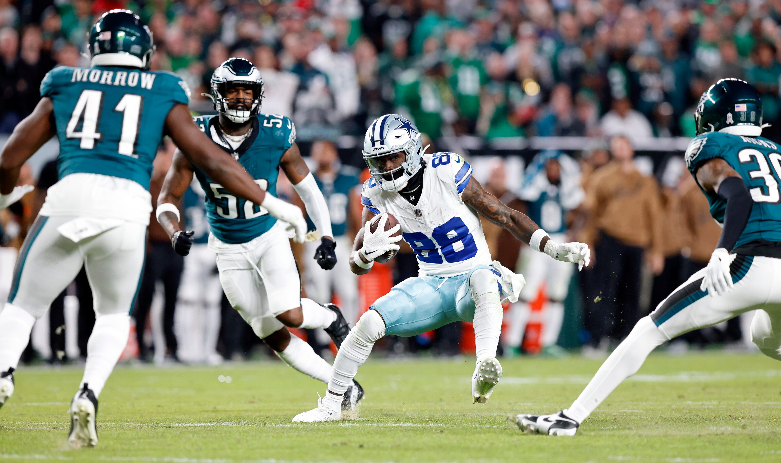 Dallas Cowboys wide receiver CeeDee Lamb (88) makes a move on Philadelphia Eagles linebacker...