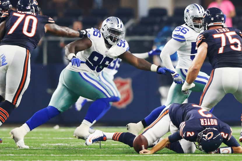 Chicago Bears quarterback Brian Hoyer (2) fumbles the ball as Dallas Cowboys defensive...