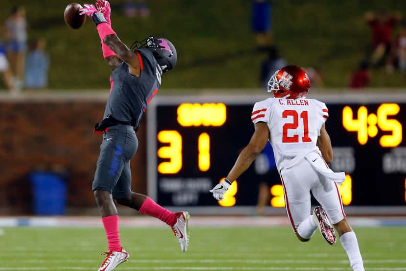 Southern Methodist Mustangs defensive back Rodney Clemons (8) tries to intercept a pass...