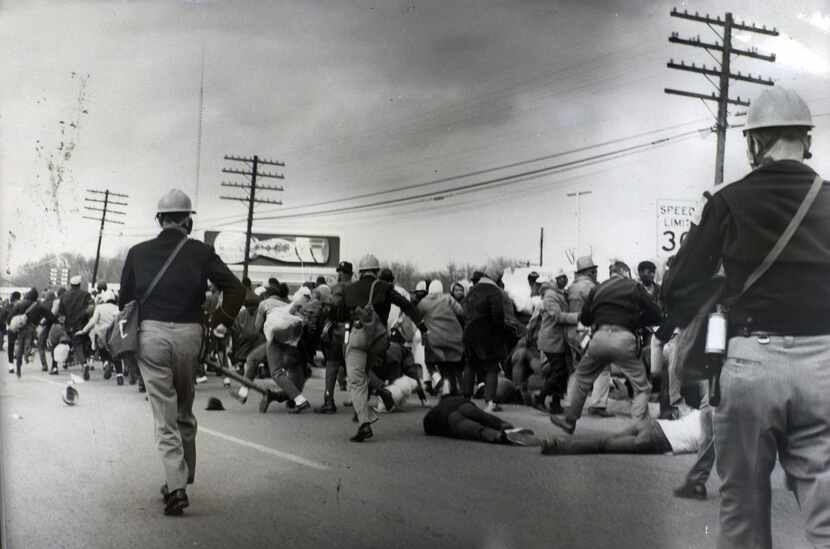
Demonstrators clash with police in 1965 in Selma, Alabama. The event helped push President...