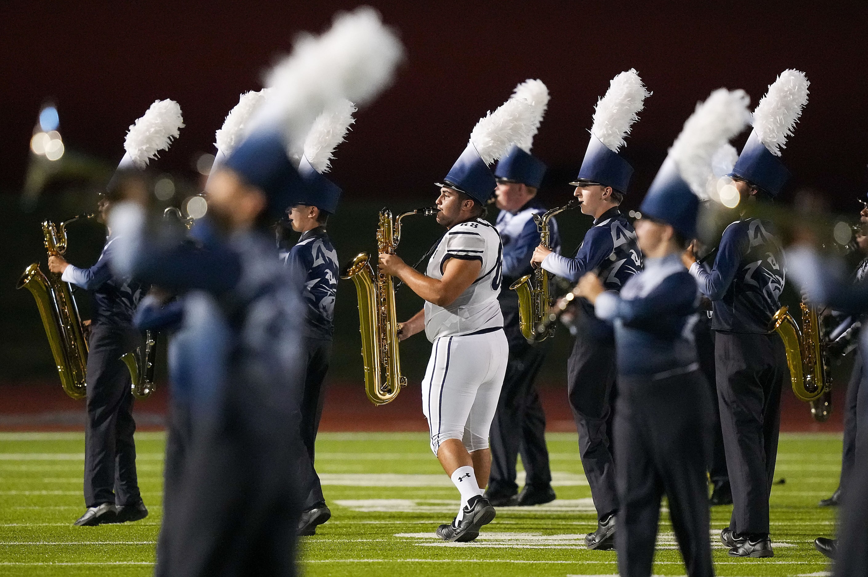 Prosper Walnut Grove defensive lineman Matthew Lopez-Quizphe performs with the marching band...