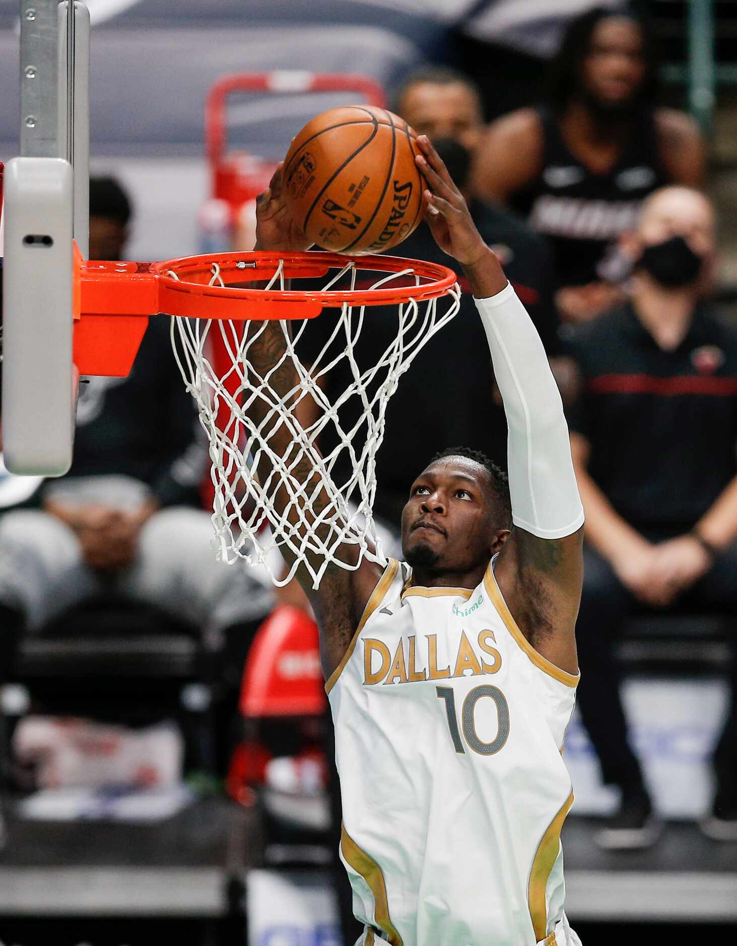 Dallas Mavericks forward Dorian Finney-Smith (10) dunks during the second half of an NBA...