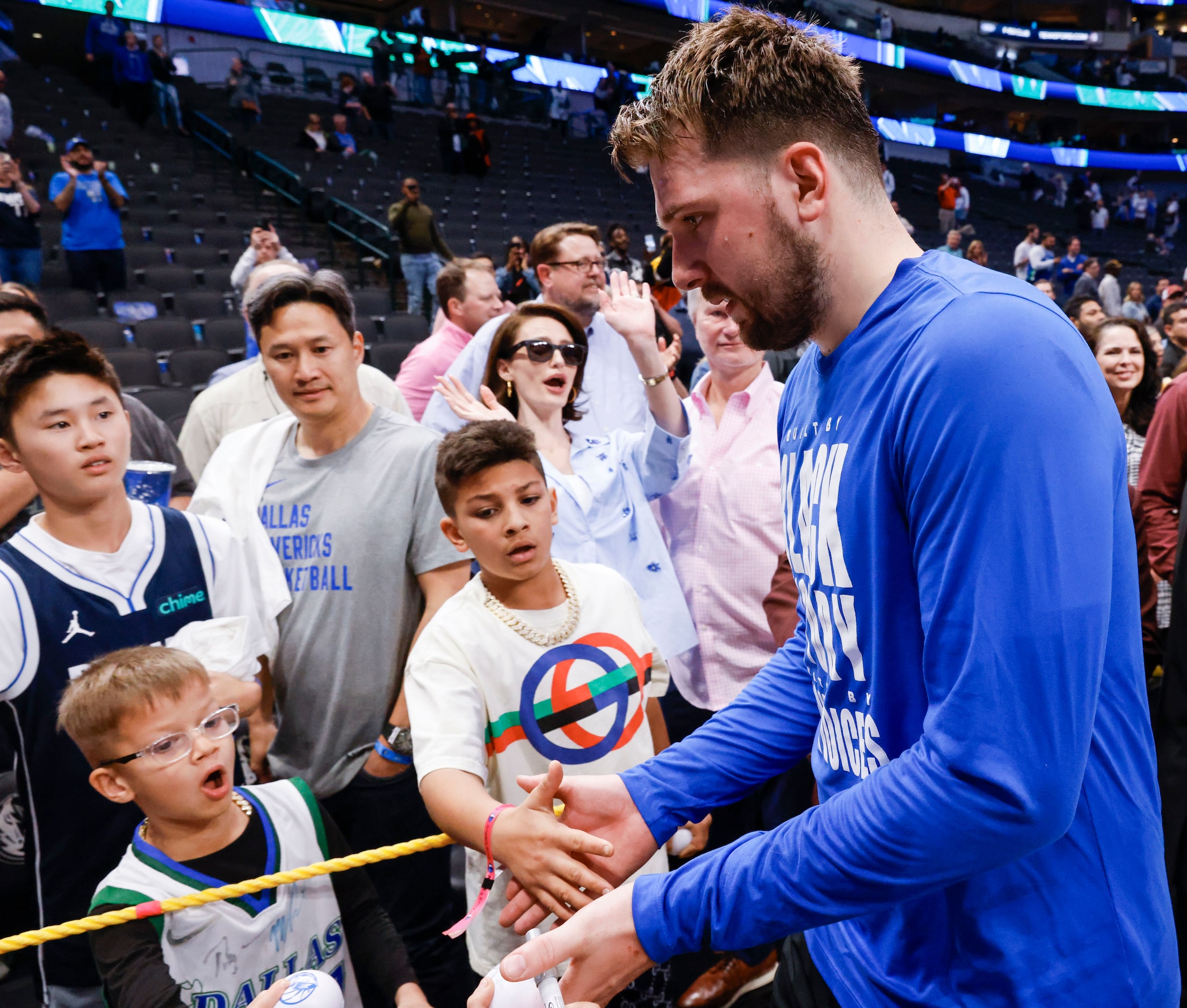 Dallas Mavericks guard Luka Doncic exits through the crowd after an NBA basketball game...