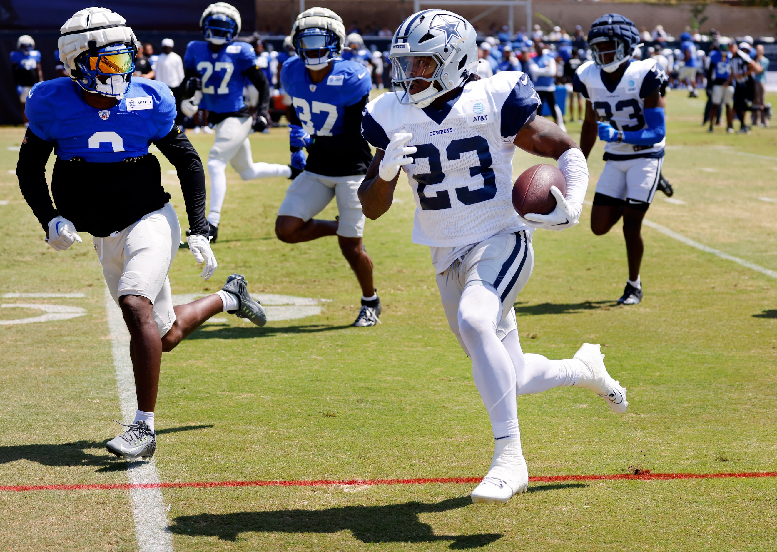 Dallas Cowboys running back Rico Dowdle (23) breaks away from the Los Angeles Rams defense...