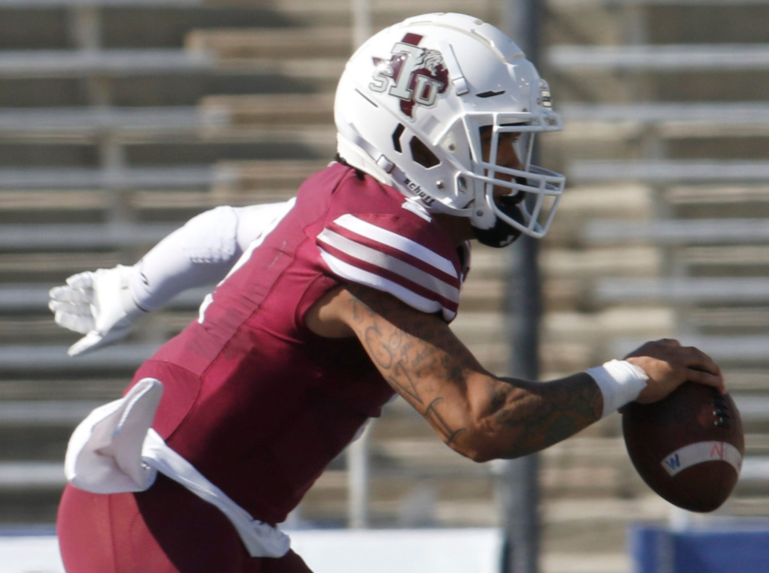 Texas Southern quarterback Devin Williams (2) avoids the Southern defensive pressure as he...