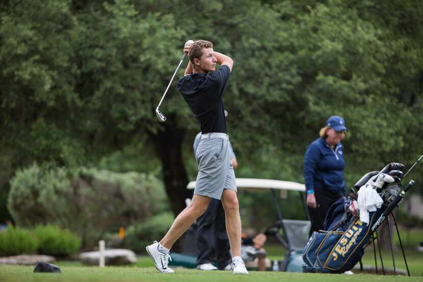 Southlake Carroll's Cole Fisher tees off on the fourth hole during the UIL Boys 6A golf...