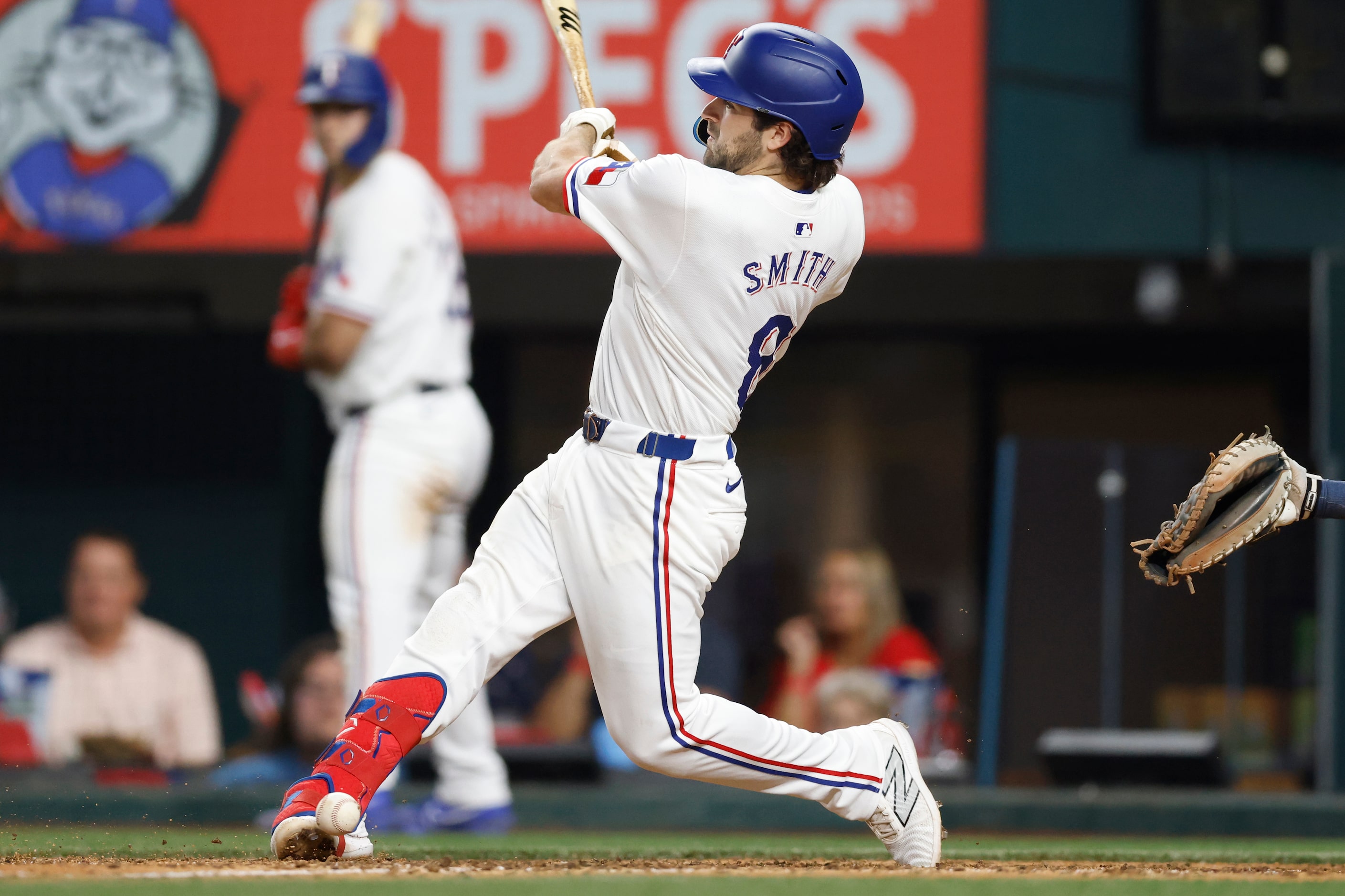 Texas Rangers shortstop Josh Smith (8) fouls a pitch off his foot during the eighth inning...