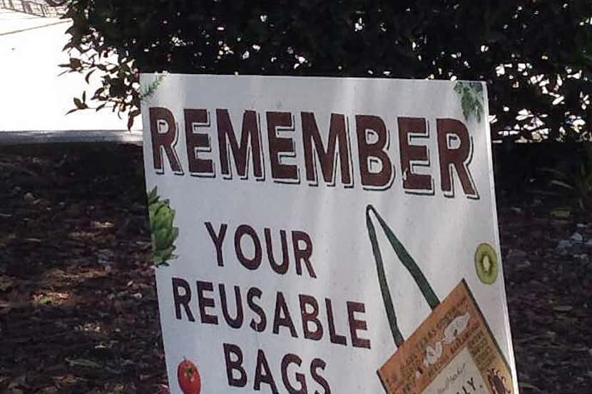 A sign suggests the use of reusable bags at Central Market at Greenville and Lovers in...