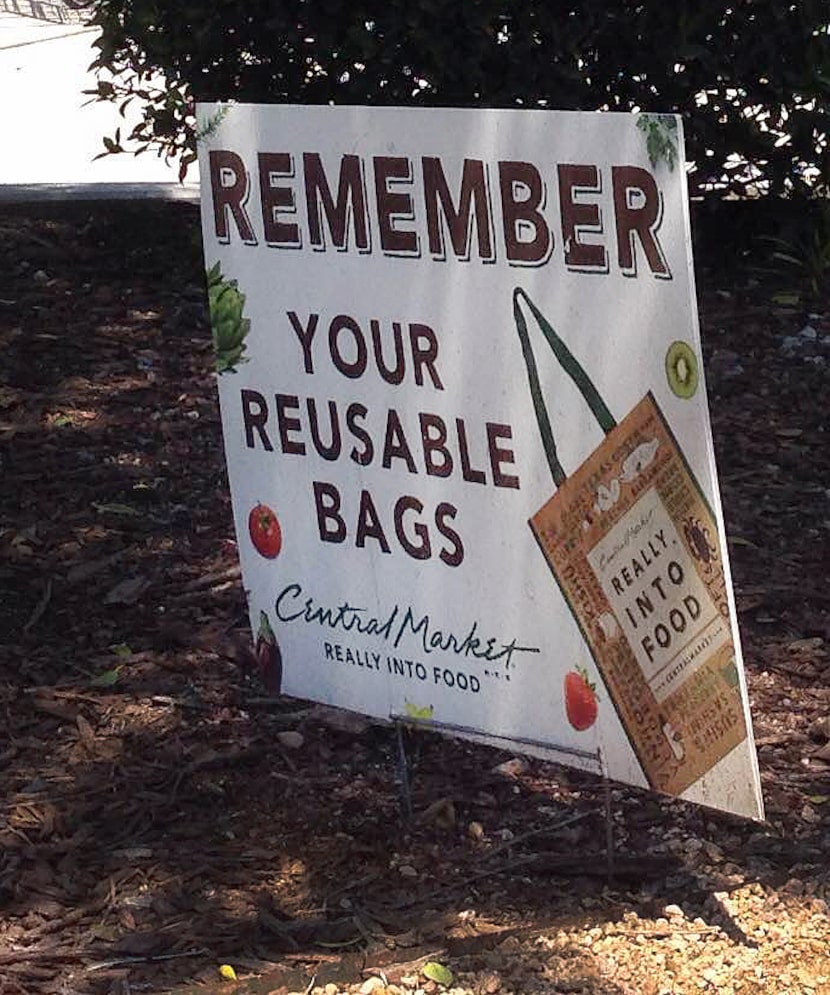 A sign suggests the use of reusable bags at Central Market at Greenville and Lovers in...