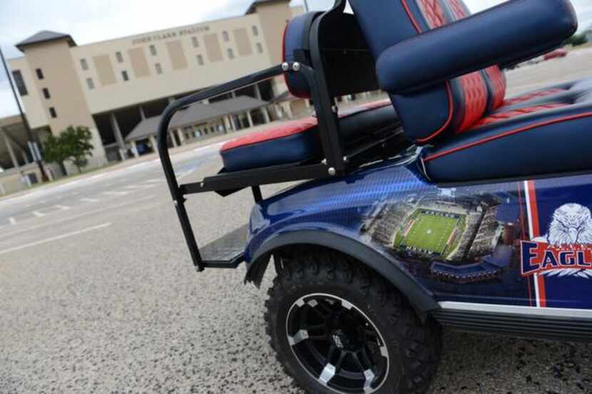 
 A golf cart, which belongs to members of the Balding Eagles Booster Club, bears a picture...