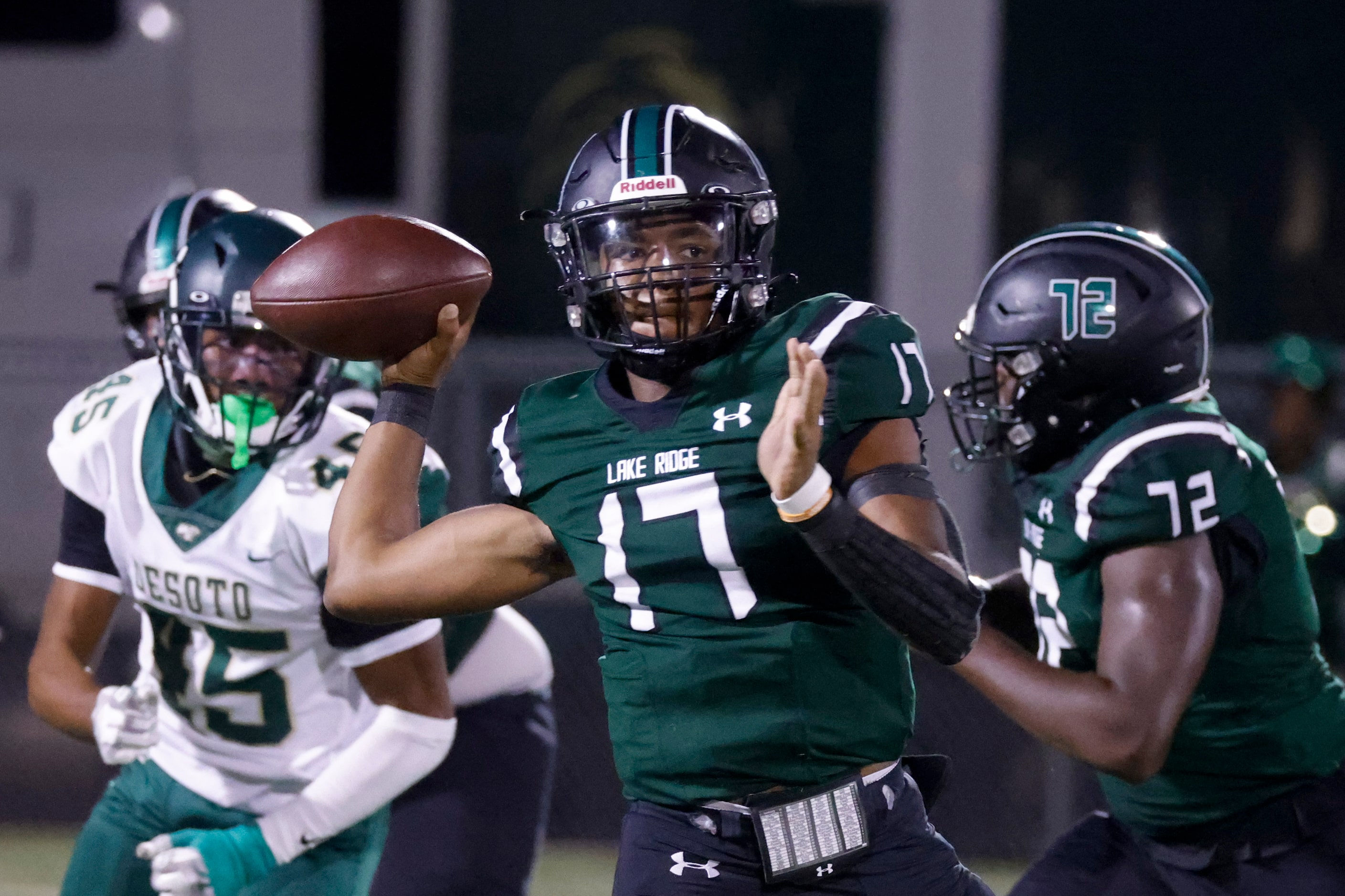 Lake Ridge High School’s QB Kennen Miller (17) throws the ball against DeSoto High School...