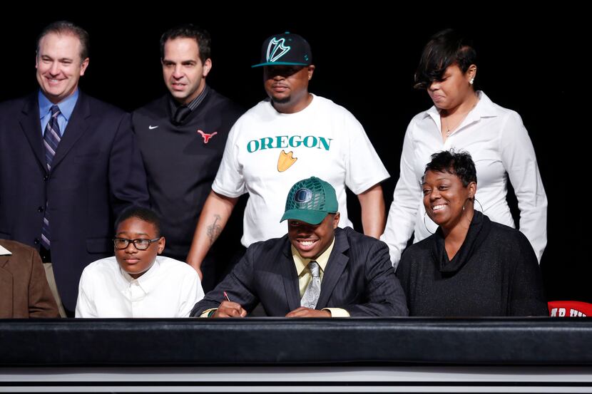 Damion Hobbs signs with the Oregon University with family and friends during the Cedar Hill...