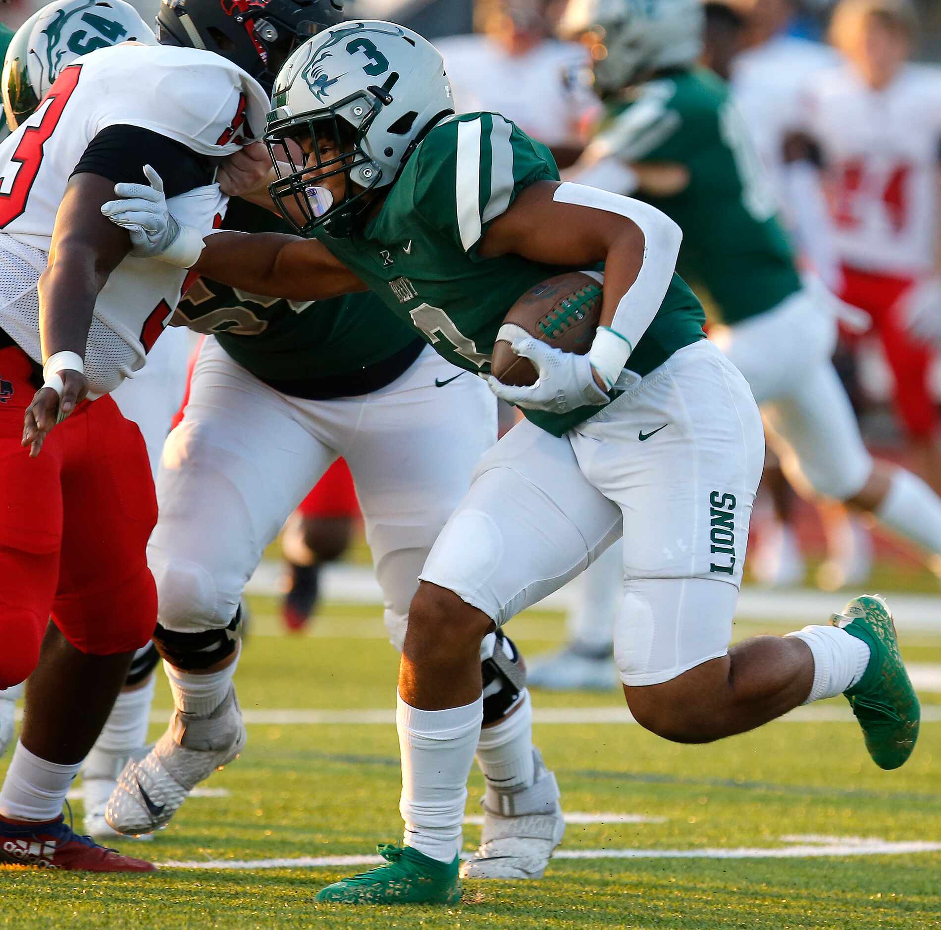 Reedy High School running back Dennis Moody (3) carries the football during the first half...