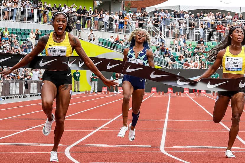American track and field sprinter Sha'carri Richardson, second from left, runs the 100...