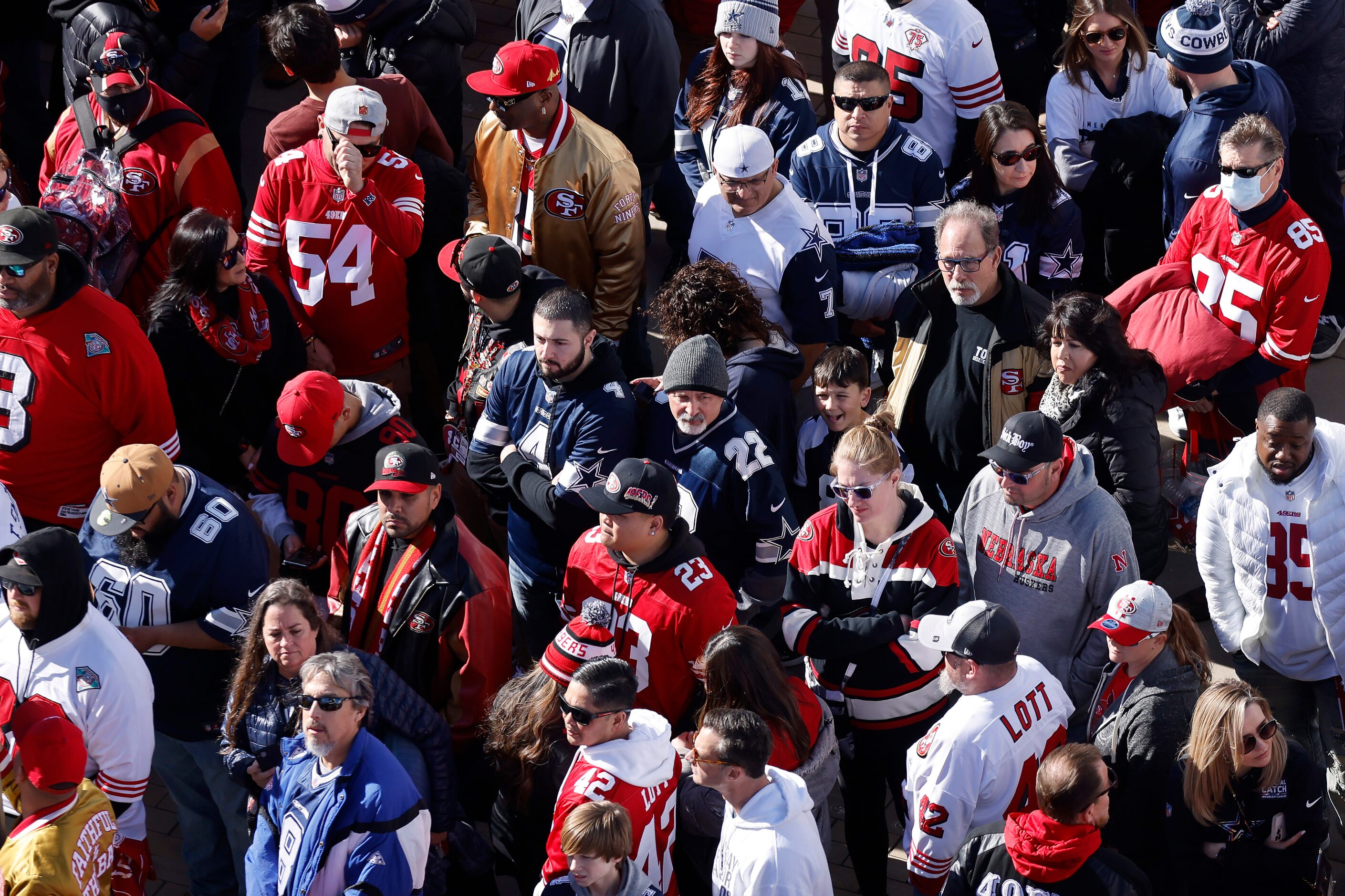 Dallas Cowboys and San Francisco 49ers fans watch wait to get into Levi’s Stadium in Santa...