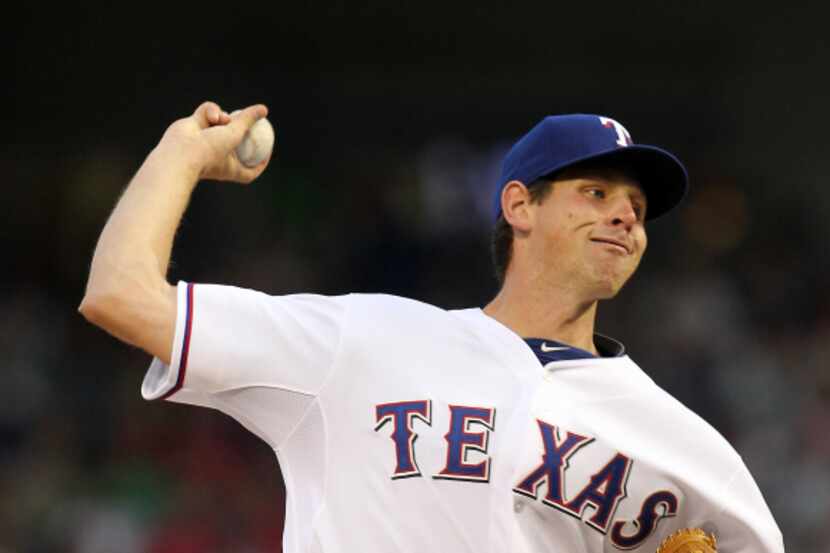 Texas Rangers starting pitcher Nick Tepesch (49) throws against the Tampa Bay Rays  in the...