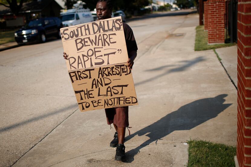 “First arrested and the last to be notified.” — Sign carried by protester Bennie Jeffery...