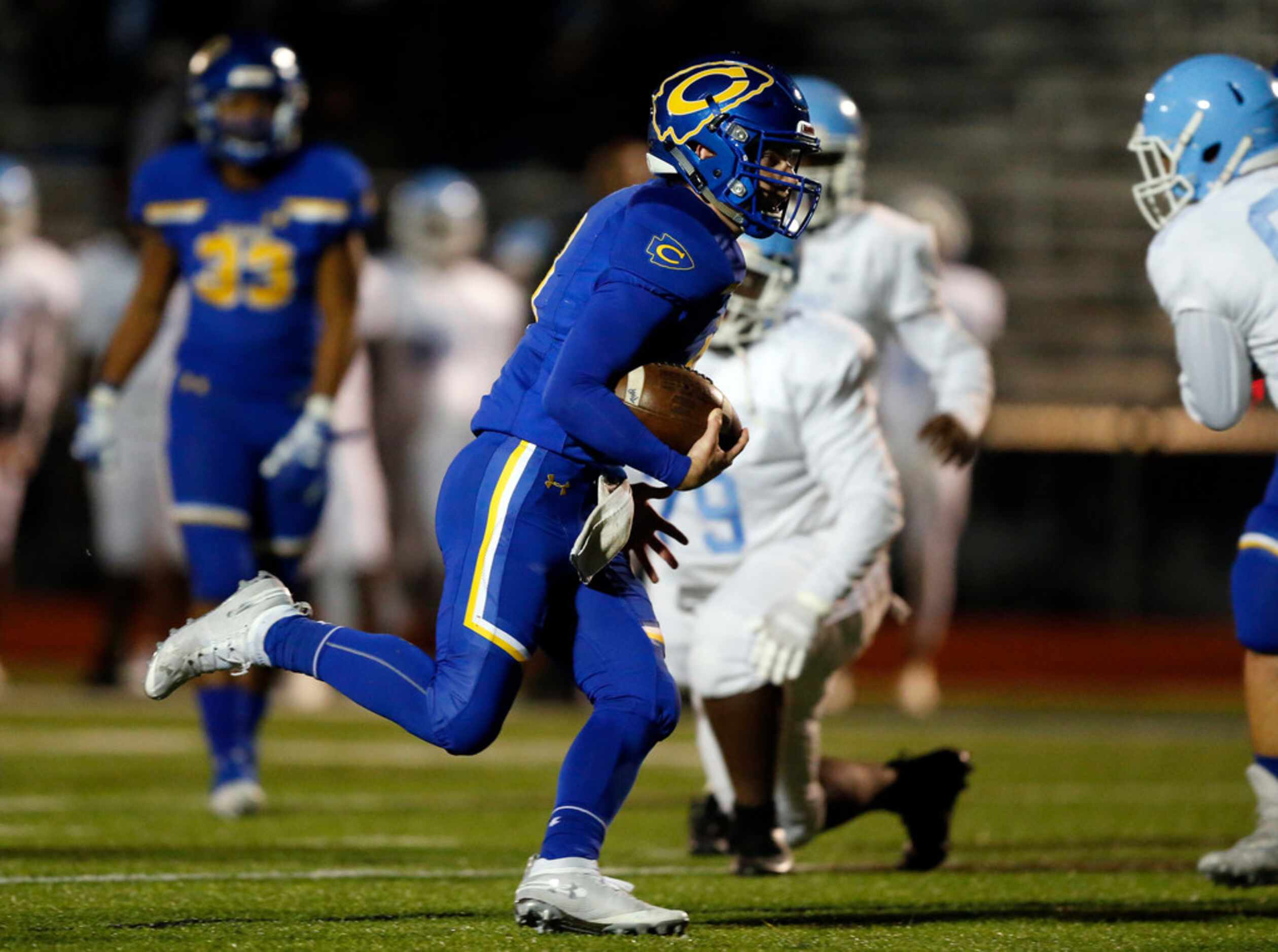 Community High quarterback Parker Simpson (8) carries the ball for a first half touchdown...