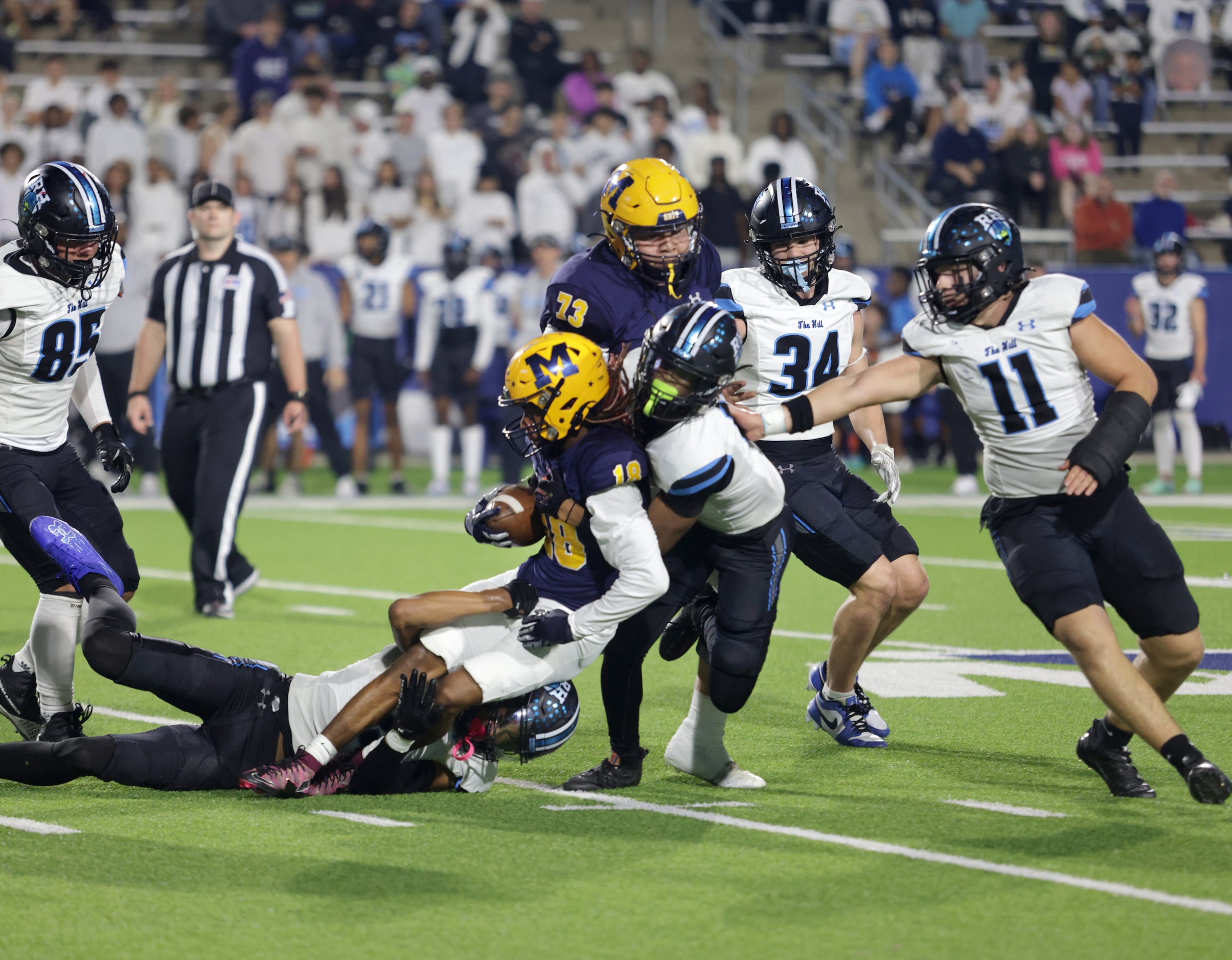 McKinney player #18 Jacoby Propes is stopped by Rock Hill player #10 Courtney Lawson during...