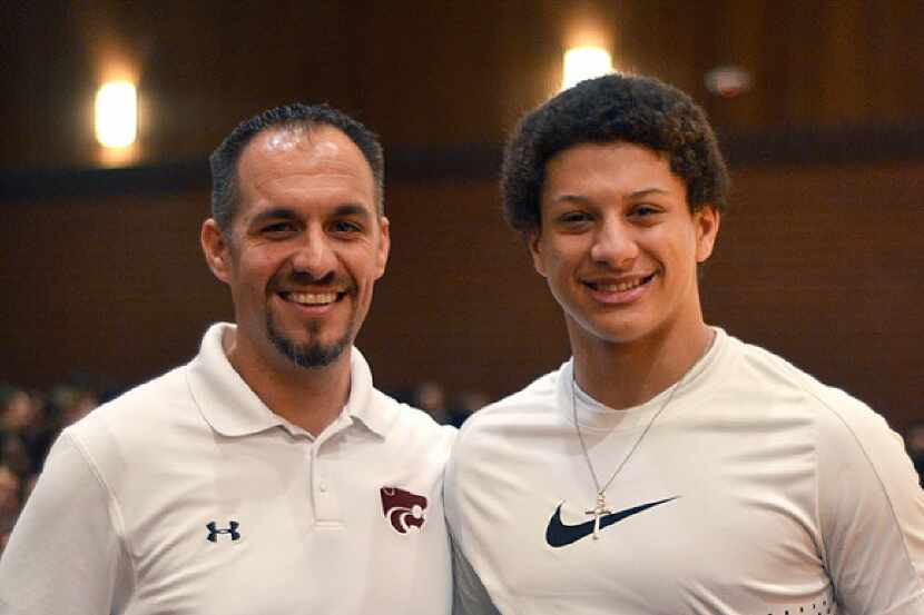 Patrick Mahomes holds his award as he poses with Whitehouse High School football coach Adam...