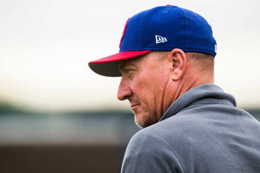 Texas Rangers manager Jeff Banister (28) watches during a spring training workout at the...