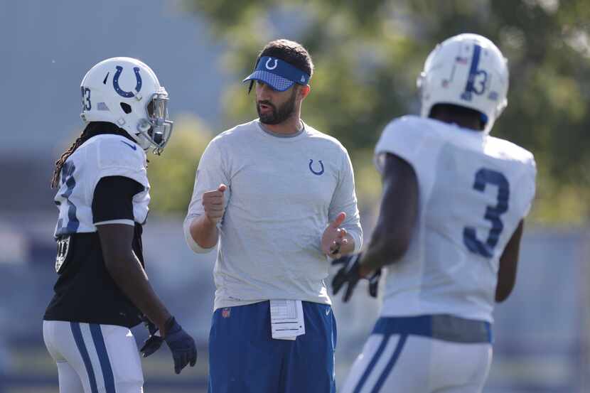 Indianapolis Colts offensive coordinator Nick Sirianni talks with wide receiver T.Y. Hilton...