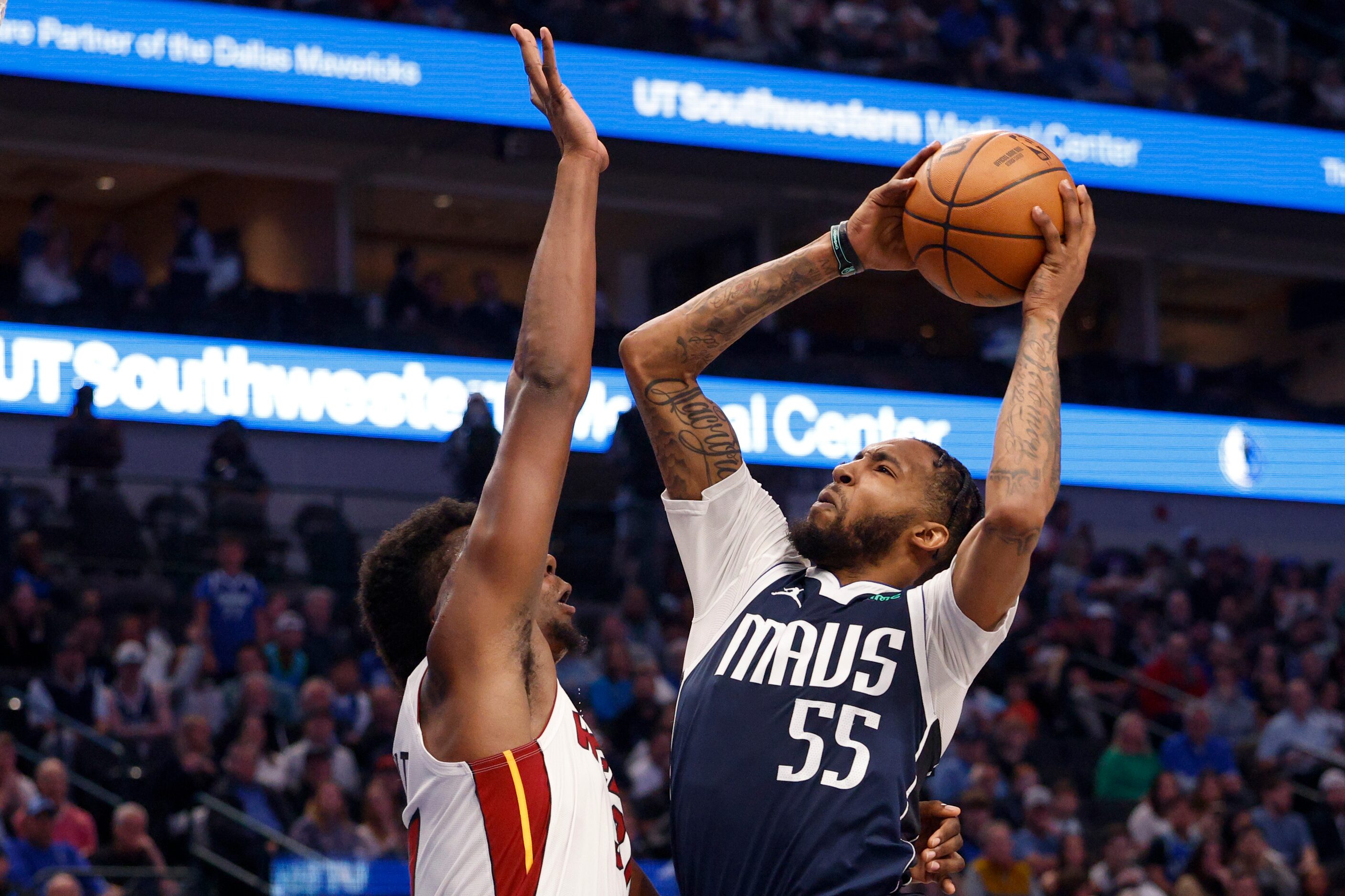 Dallas Mavericks forward Derrick Jones Jr. (55) drives to the basket against Miami Heat...